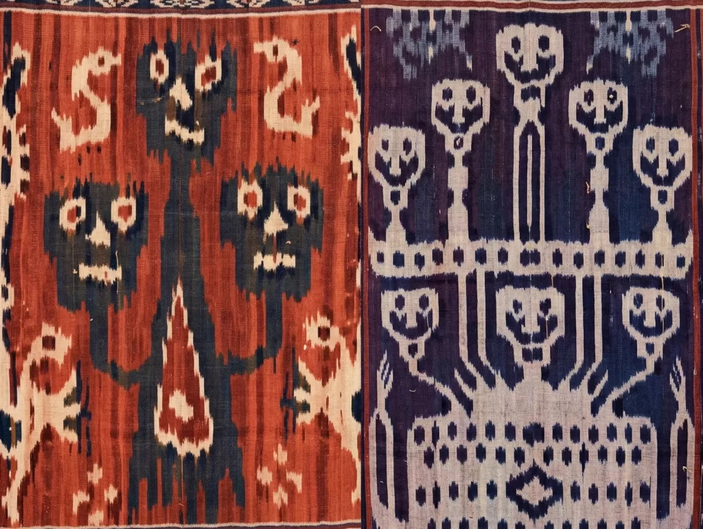 Two panels of Sumba ikat textile are displayed, featuring stylized human figures in red, white, and blue colors.